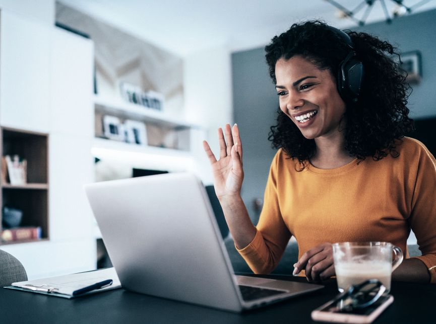 Adult student attending continuing education classes on laptop at home as part of New Harbor Capital's education innovation investment focus