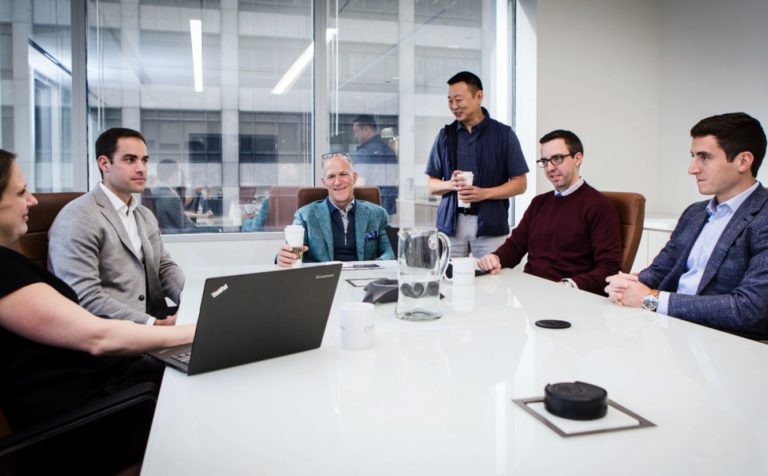 New Harbor Capital's team collaborating on lower middle-market private equity investment opportunities.