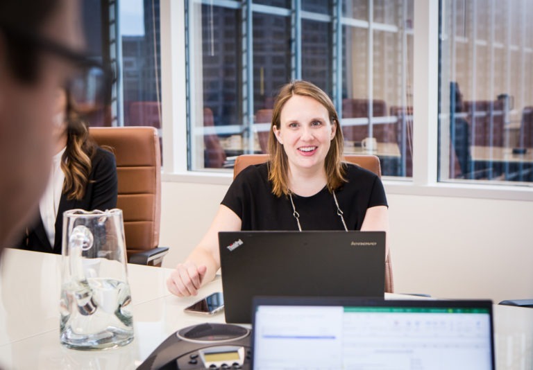 New Harbor Capital investment team member works on private equity deal.